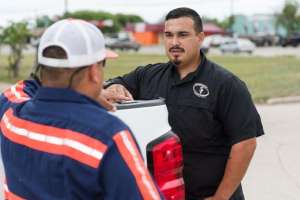 Image tailgate meeting orders paperwork team building employee relations jpg